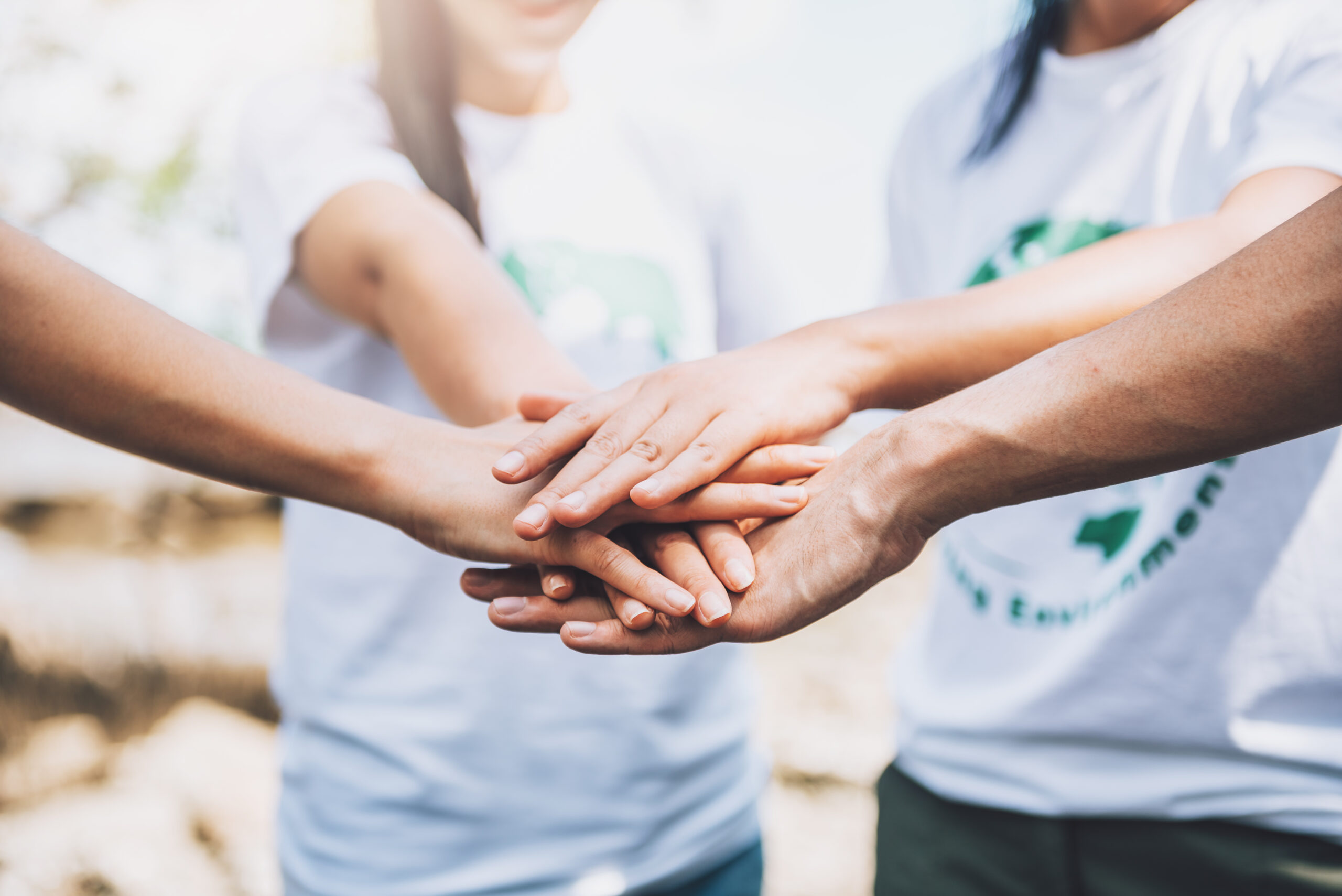 close-up-people-volunteer-teamwork-putting-finger-star-shapehands-togetherstack-handsunity-teamwork-world-environment-day close-up-people-volunteer-teamwork-putting-finger-star-shapehands-togetherstack-handsunity-teamwork-world-environment-day